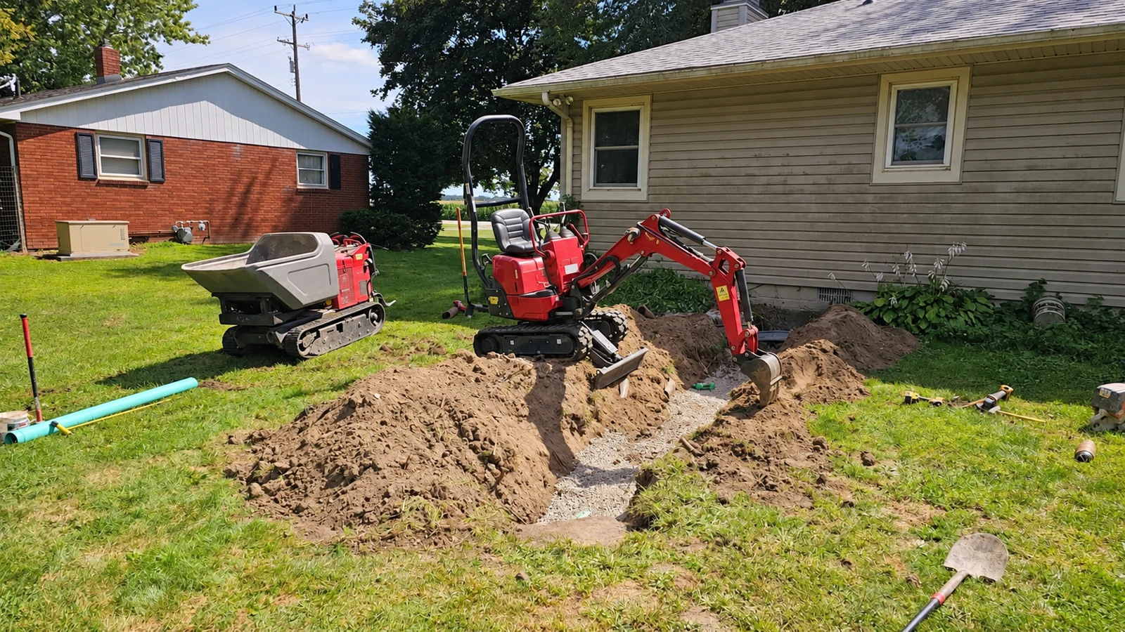 Micro excavator digging a residential service trench