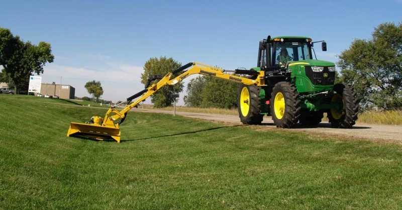 Grass cutting with a tractor-mounted boom mower