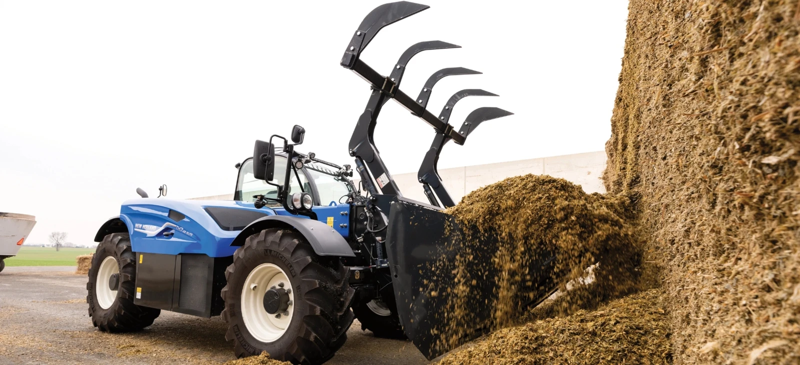 Silage handling with a bucket grapple