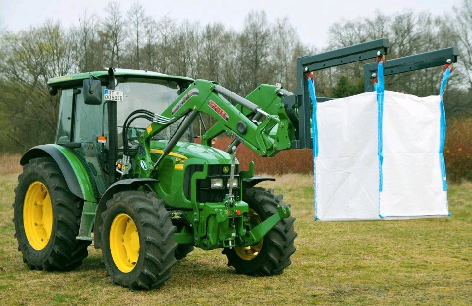 Bulk-bag lifting with a loader-mounted bag lifter