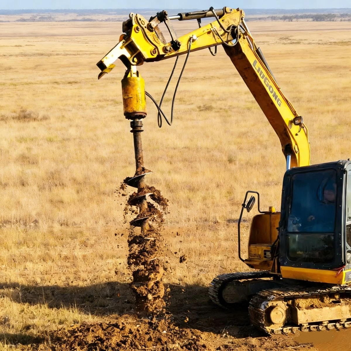 Ground drilling with an earth auger