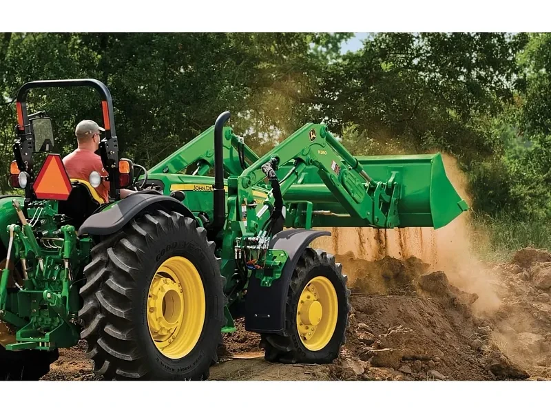 Soil loading with a tractor-loader bucket