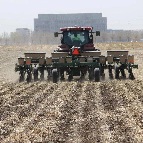 Row planting through crop residue with a no-till planter