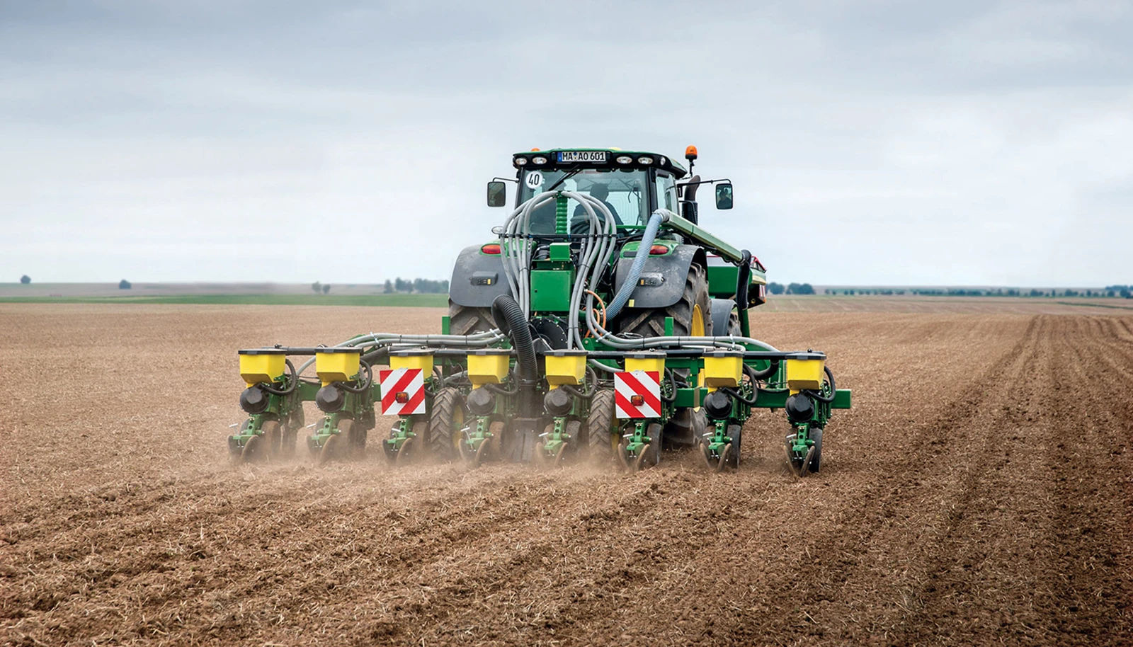 Row planting with a precision planter