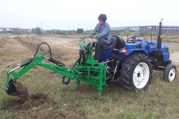 Ground excavation with a tractor-mounted backhoe