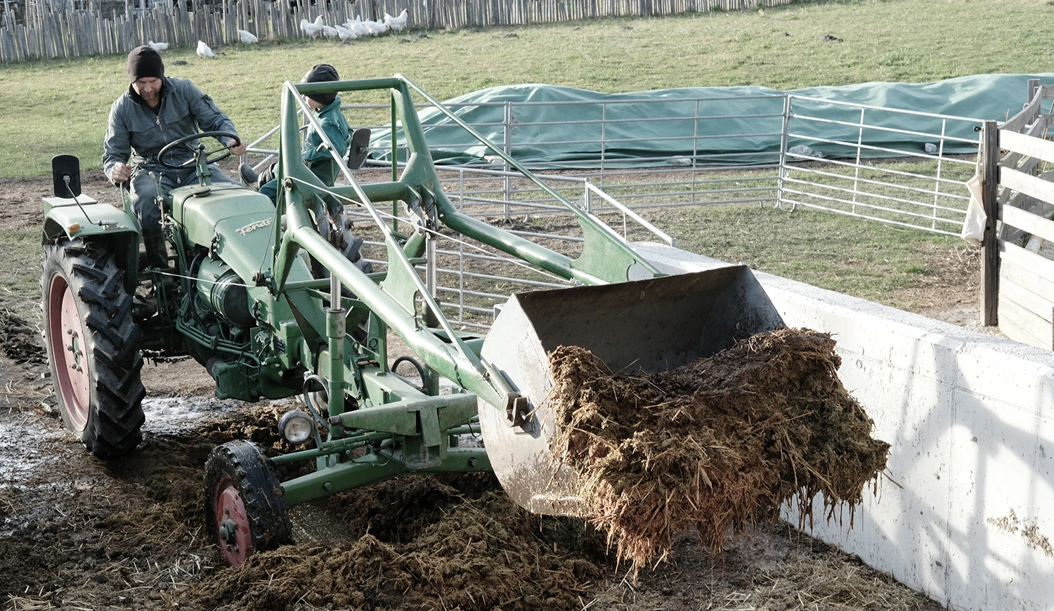 Manure loading with a tractor front loader